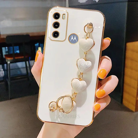 a woman holding a phone case with a ring on it