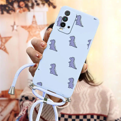 a woman holding a phone case with a pattern of dinosaurs on it