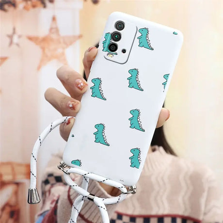 a woman holding a phone case with a green dinosaur pattern