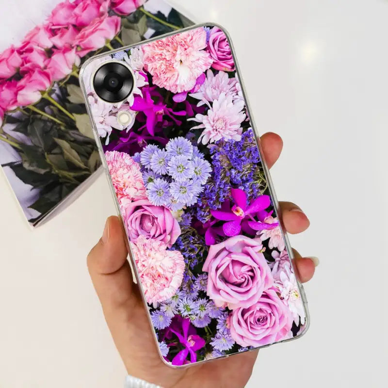 a person holding a phone case with flowers