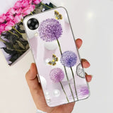 a hand holding a phone case with purple flowers