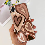 a woman holding a phone case with hearts on it