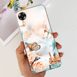 a woman holding a phone case with a butterfly and flowers on it