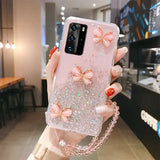 a woman holding a phone case with a pink bow