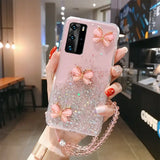 a woman holding a phone case with a pink bow