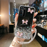 a woman holding a phone case with flowers on it