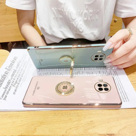 a woman is using a phone case to cover her phone