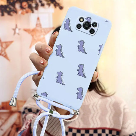 a woman holding a phone case with a pattern on it