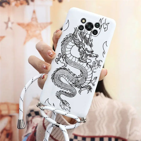 a woman holding a phone case with a dragon design