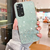 a woman holding up a phone case with glitter on it