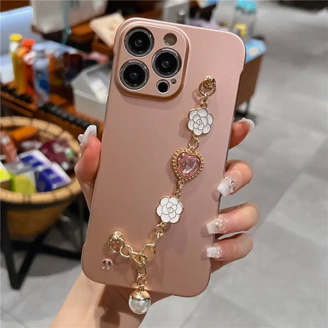 a woman holding a phone case with a flower design