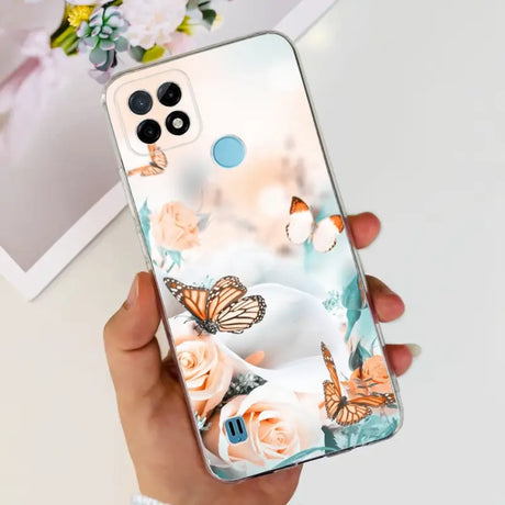 a woman holding a phone case with a butterfly design