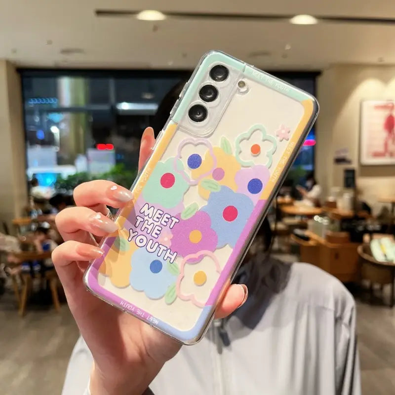 a woman holding up a phone case with the words’best day ever ’