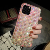 a woman holding a phone case with a pink and silver glitter design