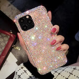 a woman holding a phone case with a diamond pattern