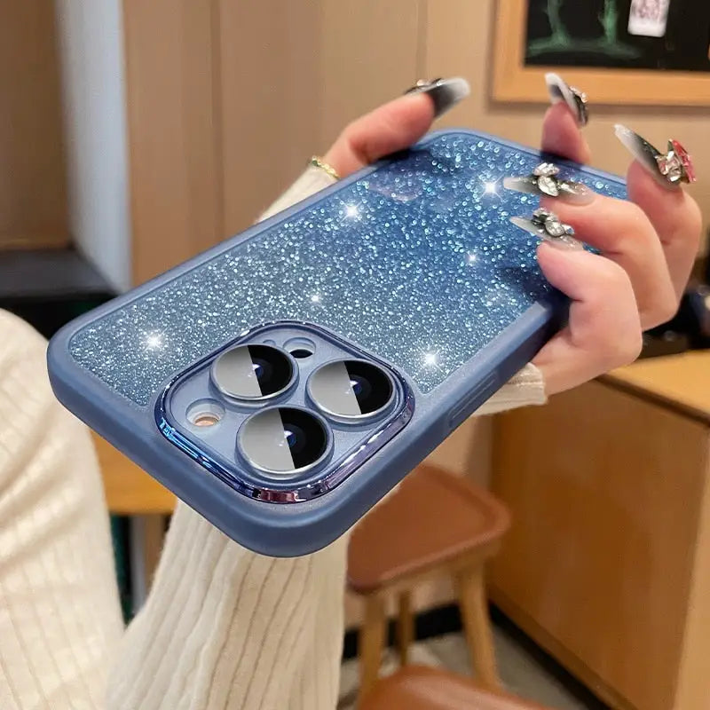 a woman holding a phone case with a blue glitter effect
