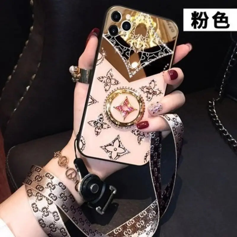 a woman holding a phone case with a watch on it