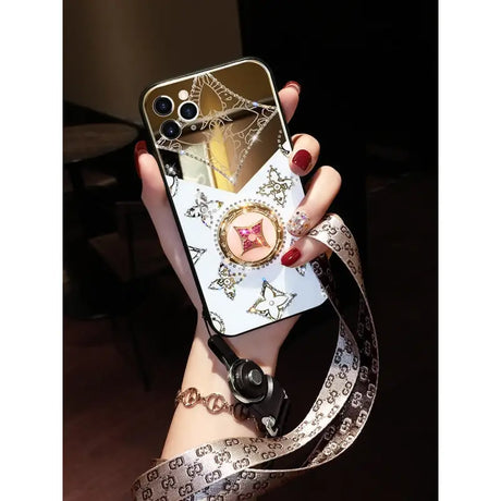 a woman holding a phone case with a watch on it