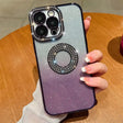 a woman holding a phone case with a ring on it