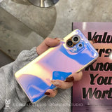 a woman holding a phone case with a blue and pink liquid liquid