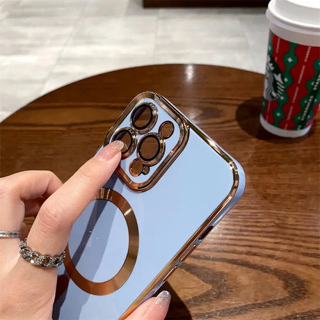 a woman holding a phone with a ring on it