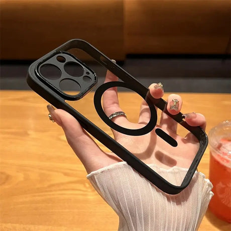 a woman holding a phone case with a ring on it