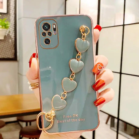 a woman holding a phone case with a ring on it