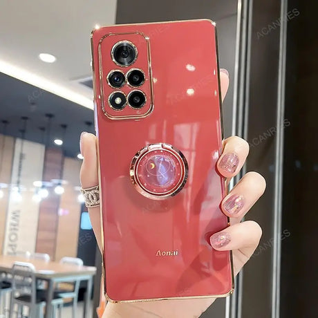 a woman holding a red phone case with a camera