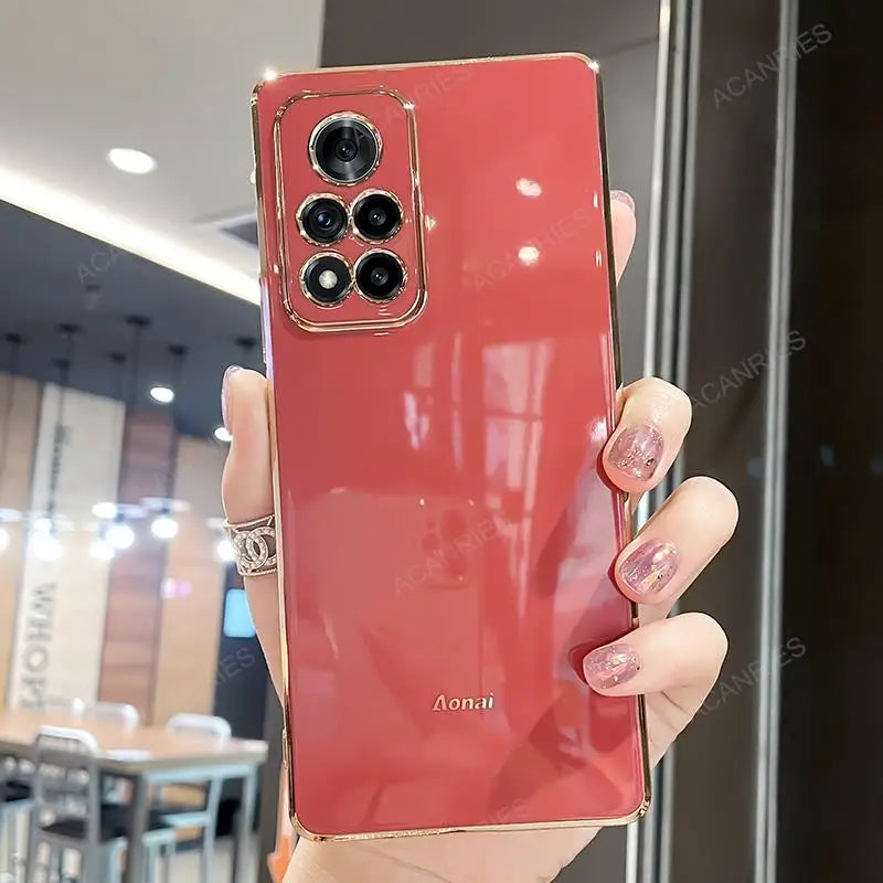 a woman holding up a red phone case