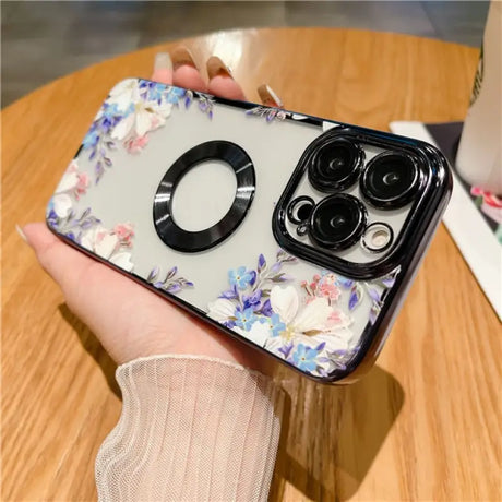 a woman holding a phone case with a flower pattern