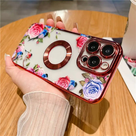 a woman holding a phone case with flowers on it