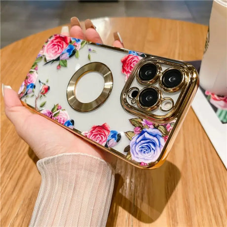 a woman holding a phone case with flowers on it