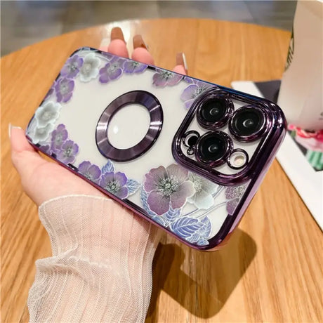 a woman holding a phone case with a flower design