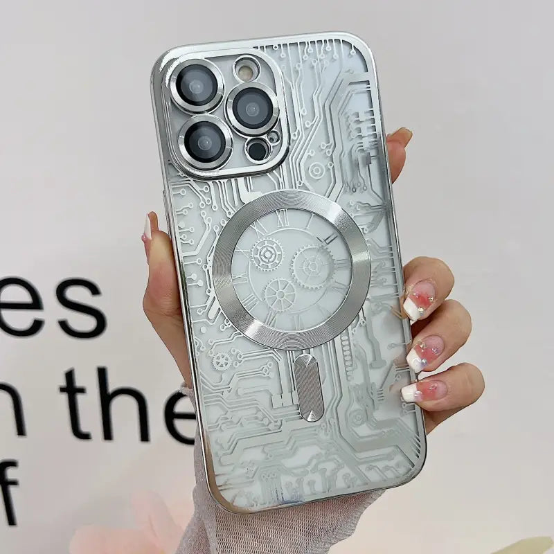 a woman holding a phone case with a silver design