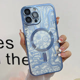 a woman holding a phone case with a blue and white pattern