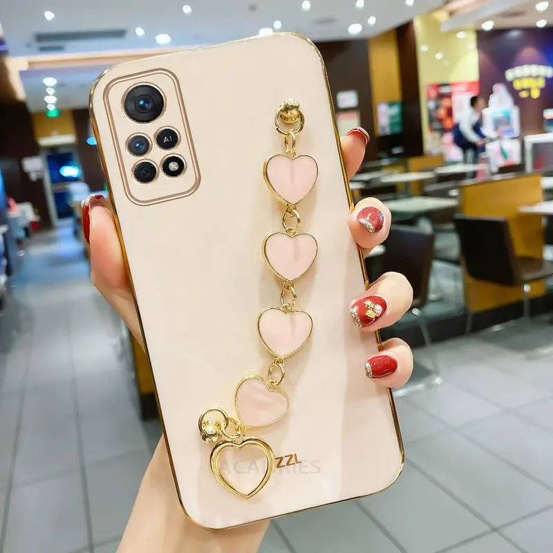 a woman holding a phone case with a ring on it