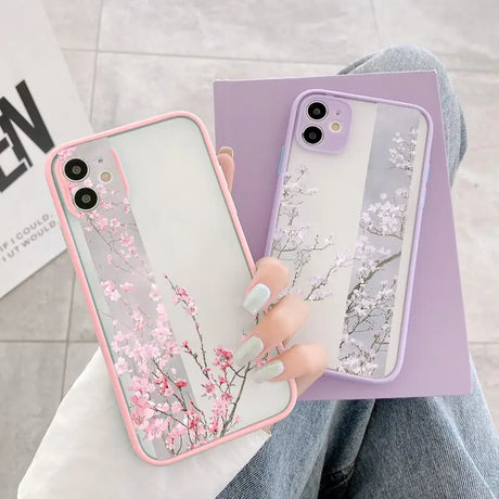 a woman holding a phone case with a pink flower on it