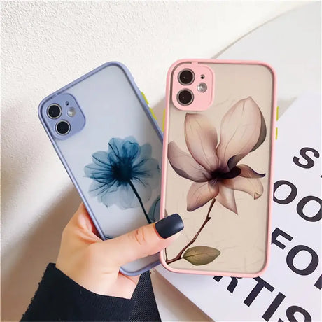 a woman holding a phone case with a flower on it