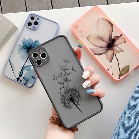 a woman holding a phone case with a flower design