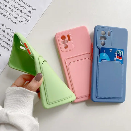 a person holding a phone case with a card holder