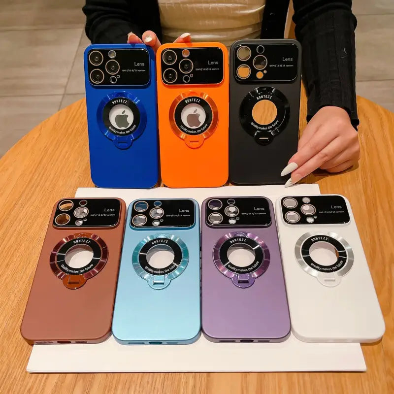 a woman holding a phone case with three different colors