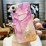 a woman holding up a phone case with a purple marble pattern