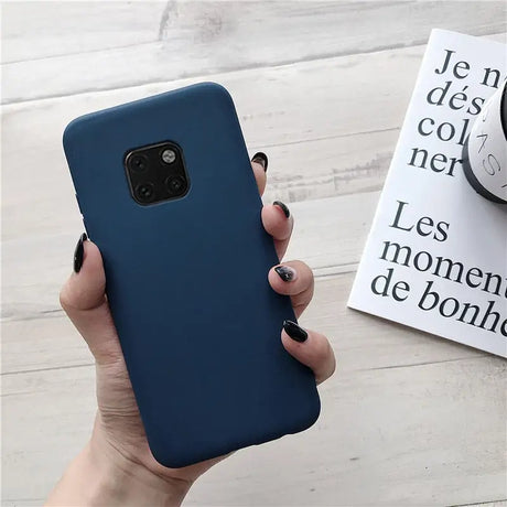 the back of a blue iphone case with a hand holding it