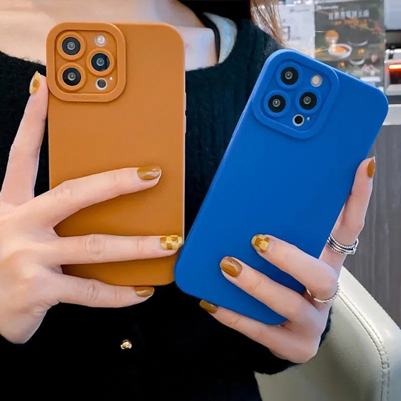 a woman holding a phone case in her hands
