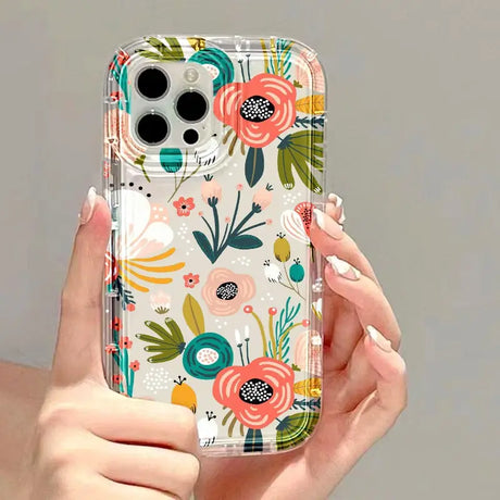 a woman holding a phone case with a floral pattern