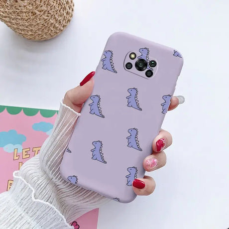 a woman holding a phone case with a pattern on it