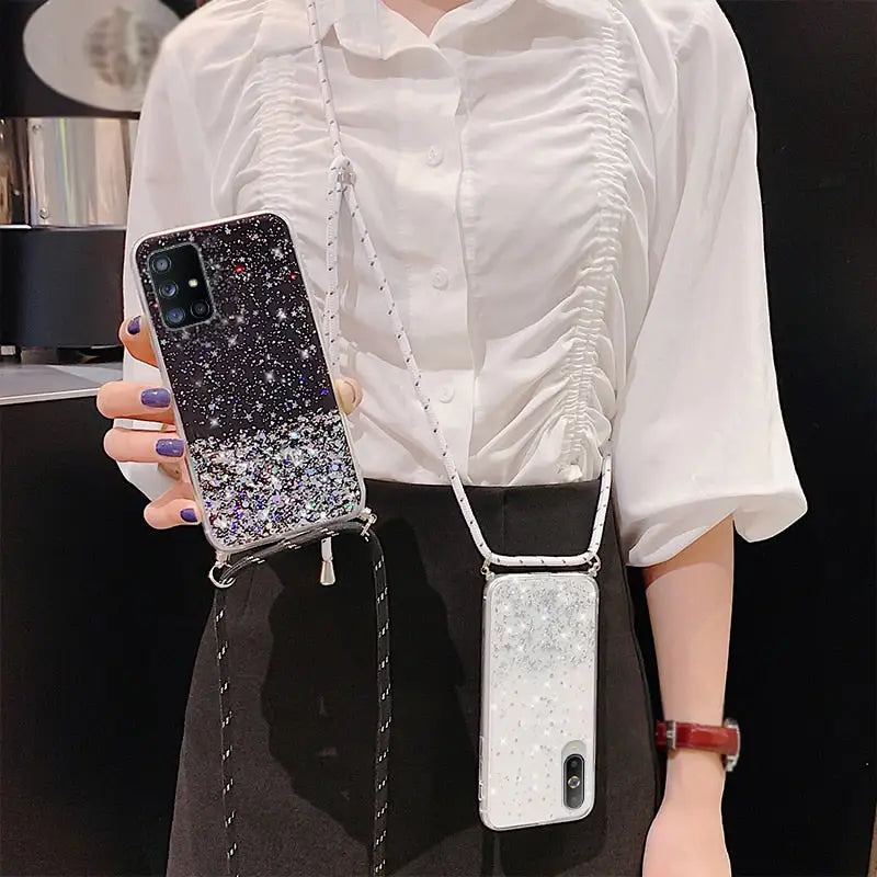a woman holding a phone case with a silver glitter phone