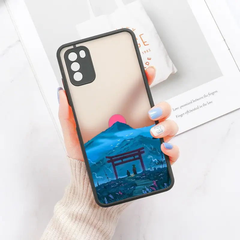 a woman holding a phone case with a picture of a japanese temple
