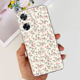 a woman holding a phone case with a floral pattern