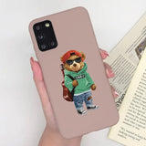 a person holding a phone case with a bear